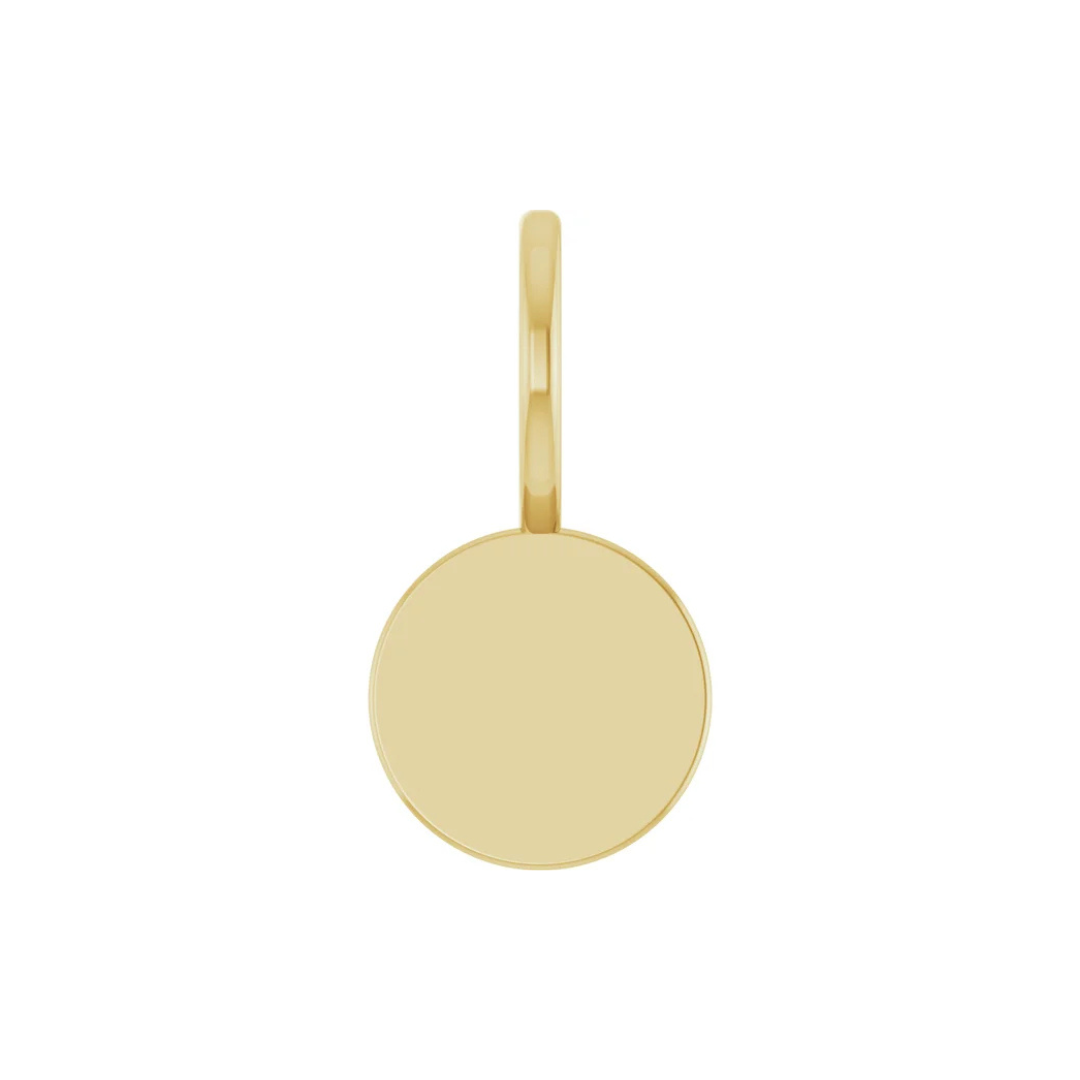 Gold pendant on a white background