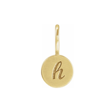 Gold pendant with the letter 'h' on a white background