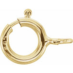 A gold-colored metal clasp with an attached ring, likely used for jewelry making.