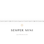 A sleek, gold-colored Semper Mini chain necklace with a small logo pendant on a white background.