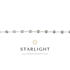 Silver bracelet with 'Starlight' branding on a white background