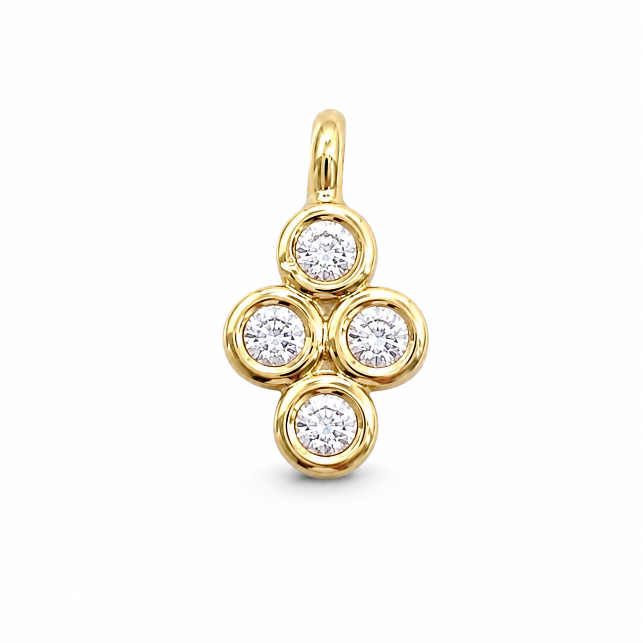 A yellow gold pendant featuring four round-cut clear gemstones arranged in a cross or flower-like cluster, set against a plain white background.