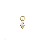 Gold pendant with a clear gemstone on a white background