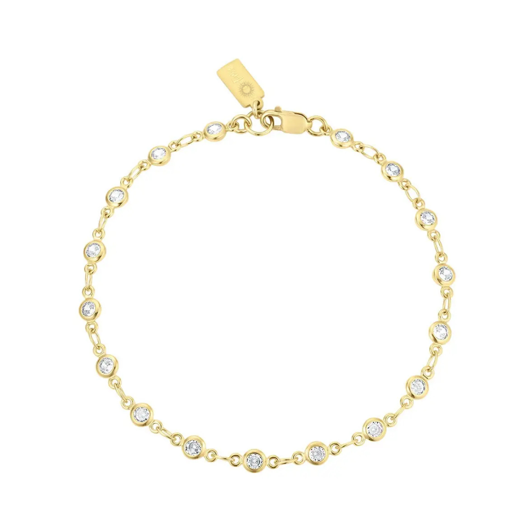Gold bracelet with clear stones on a white background