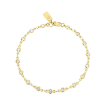 Gold bracelet with clear stones on a white background
