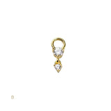 Gold earring with two clear gemstones on a white background