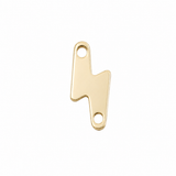 A polished gold lightning bolt charm with two circular holes, shown on a solid white background.