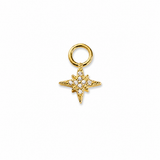 A gold starburst charm with a central ring of clear cubic zirconia stones, suspended from a gold jump ring, shown on a plain white background.