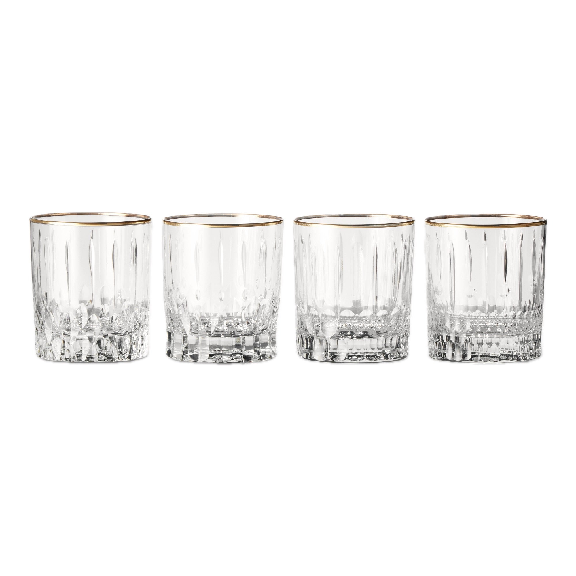Four clear glass tumblers with gold rims on a white background