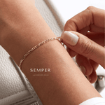 Woman showing her permanent jewelry strength.