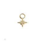 Gold star-shaped pendant with embedded stones on a white background