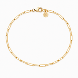 Gold bracelet with a Golden Bond marker charm on a white background