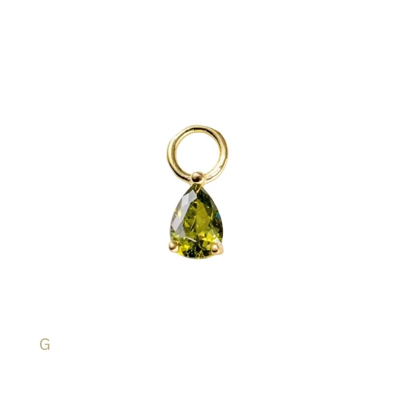 Gold pendant with a green teardrop-shaped gemstone on a white background