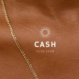 A close-up image of a bracelet with interlocked gold chains against a light background.